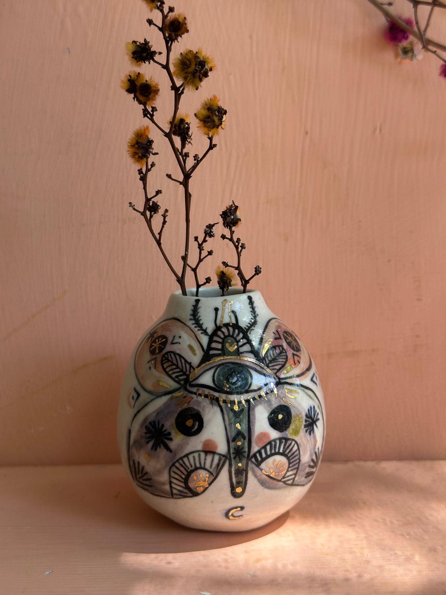 ‘Hand painted ‘the protective eye’ moth vase