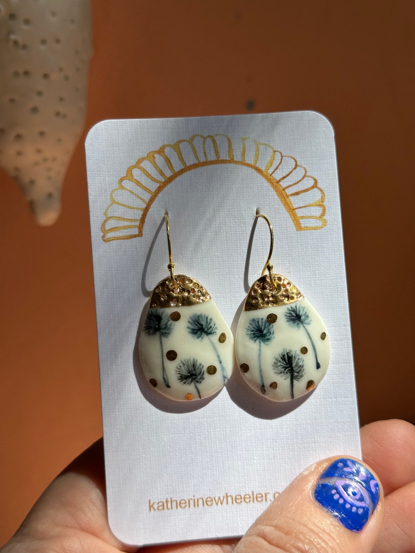 Indigo Hand Painted Dandelion Porcelain Earrings with gold does