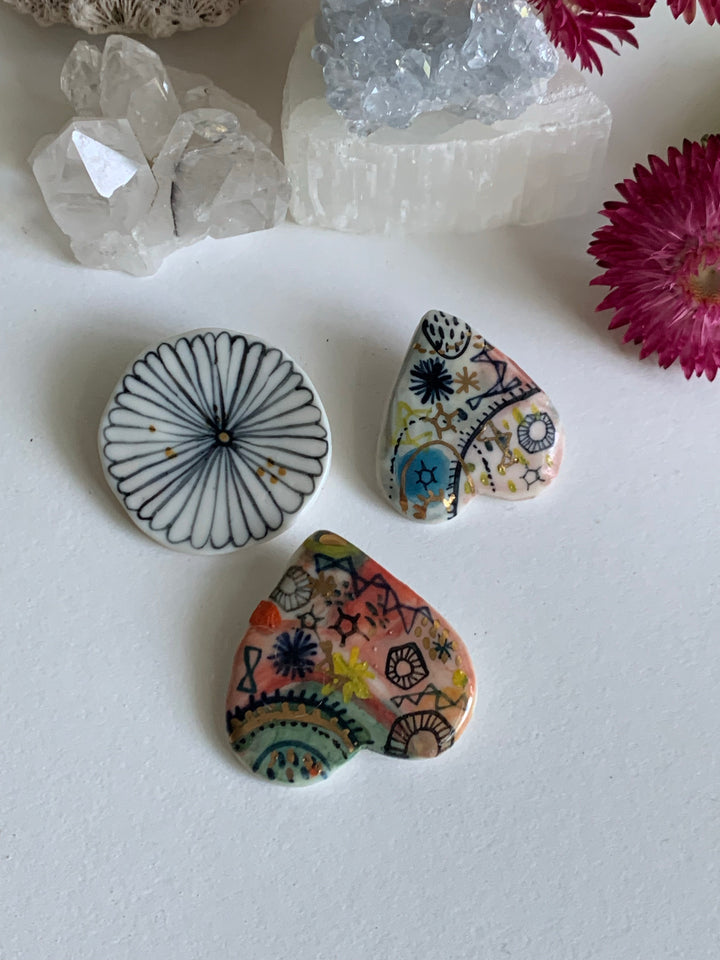 Brooches, coral and handpainted designs – Katherine Wheeler Ceramics